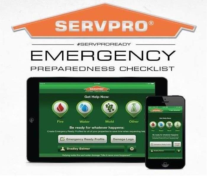 We help your business get open faster! Tablet and phone with SERVPRO logo.